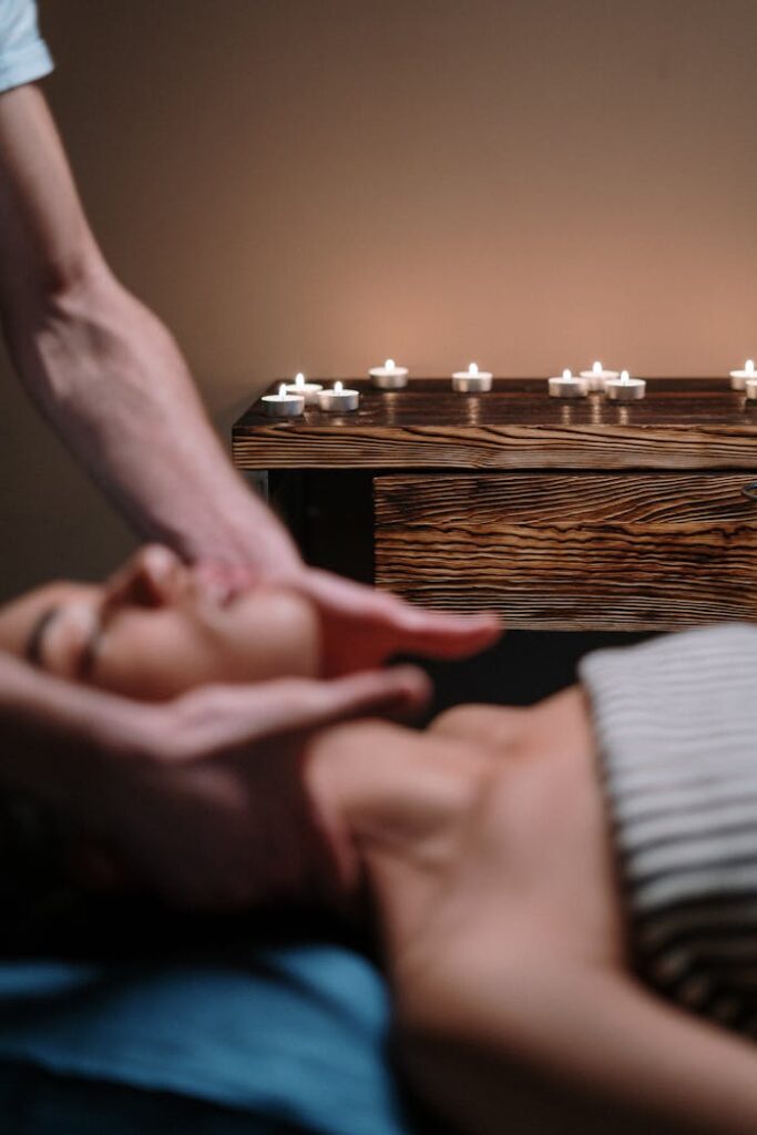 A serene spa treatment with facial massage and candlelight ambiance.